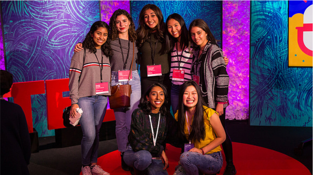 A group of student presenters posing for a photo