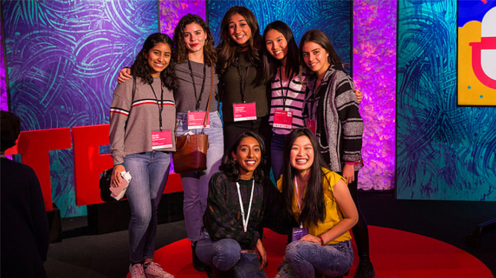 A group of student presenters posing for a photo