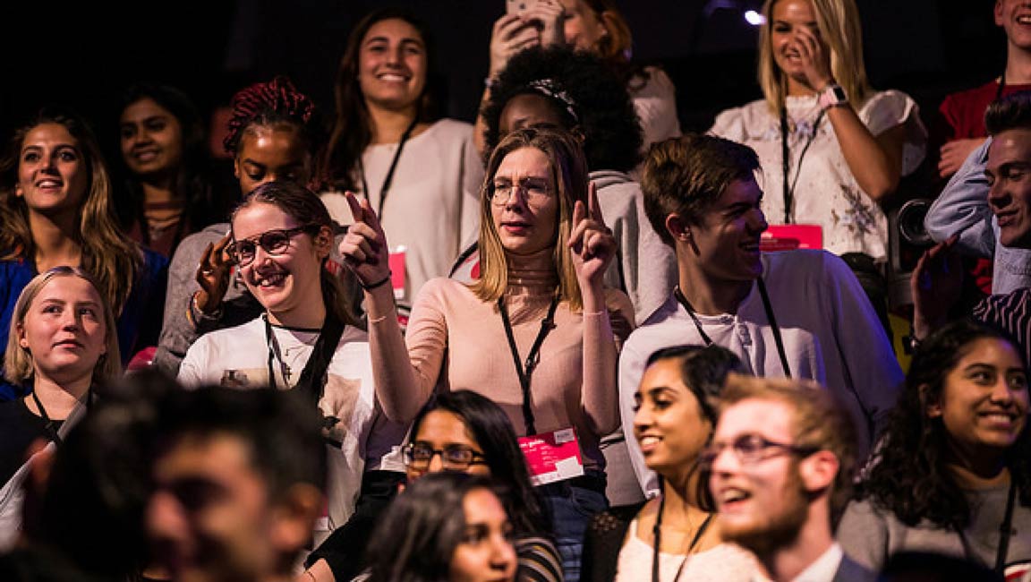 An audience responding with laughter